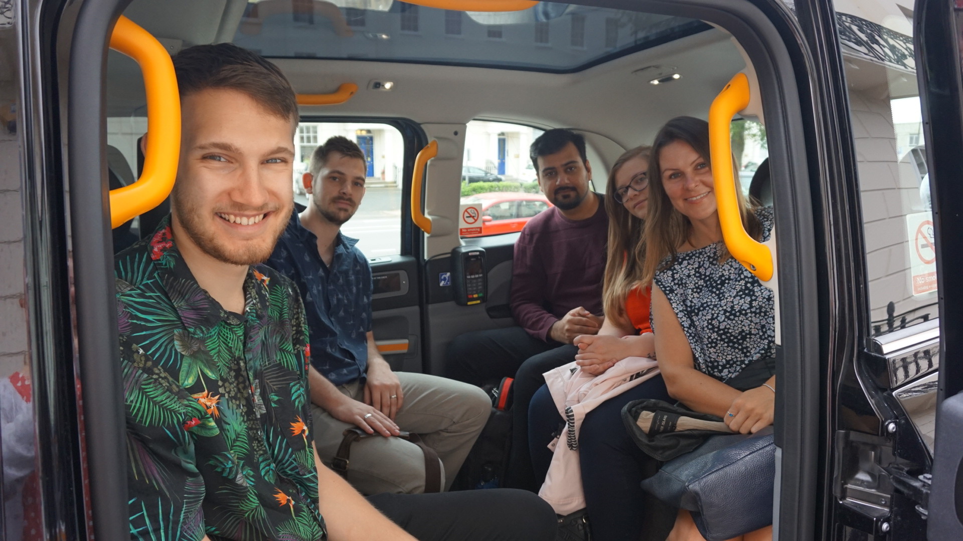People sitting in a taxi