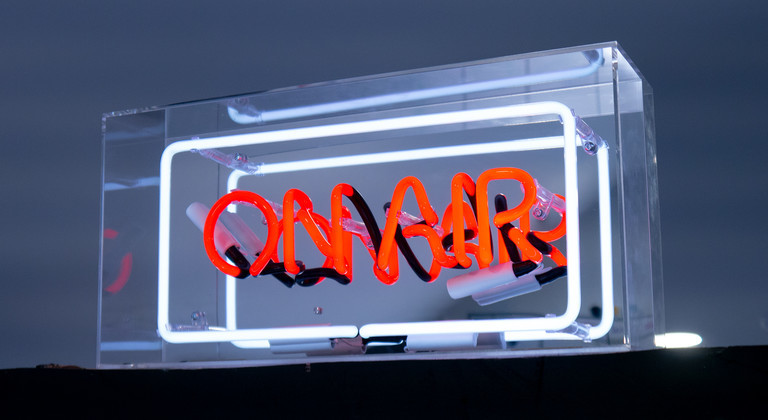 On Air neon sign in a transparent acrylic box